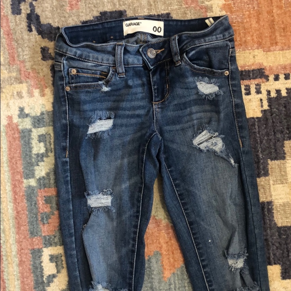 Garage Low rise medium-wash ripped jeans. Size 00